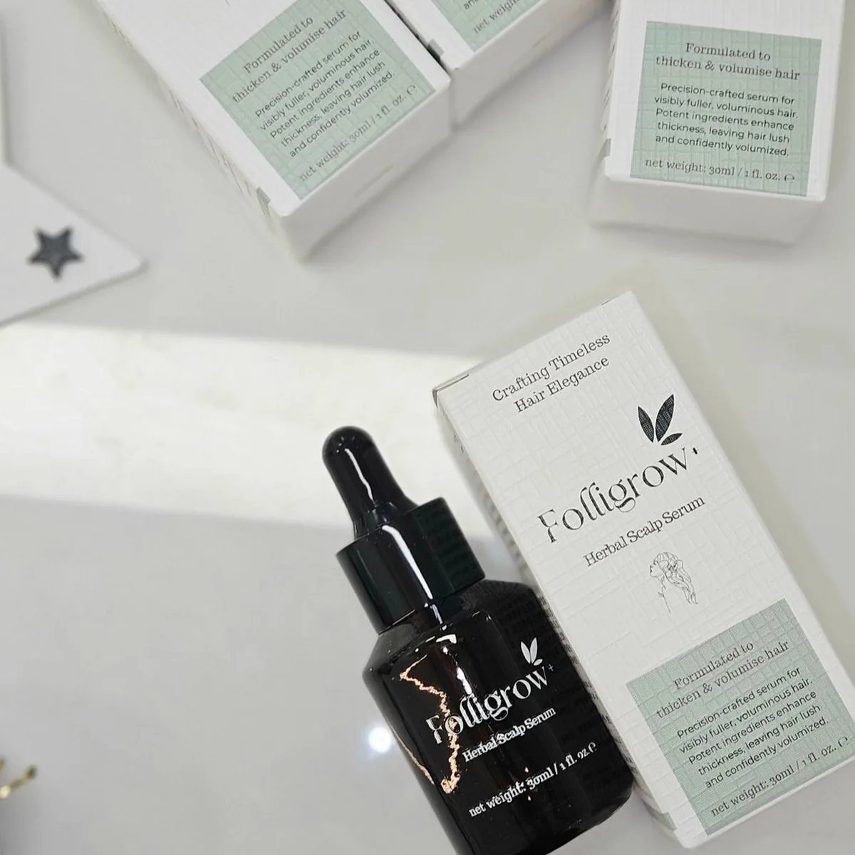 Close-up of a Folligrow+ serum bottle
