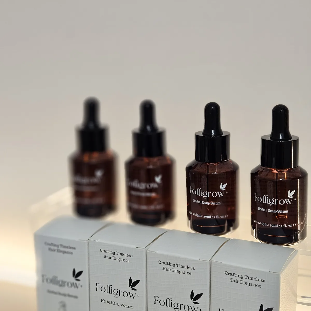 A row of Folligrow+ serums and boxes
