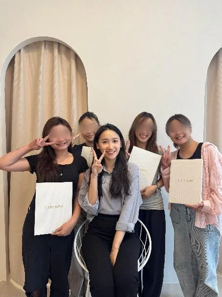 Graduates holding their certificates