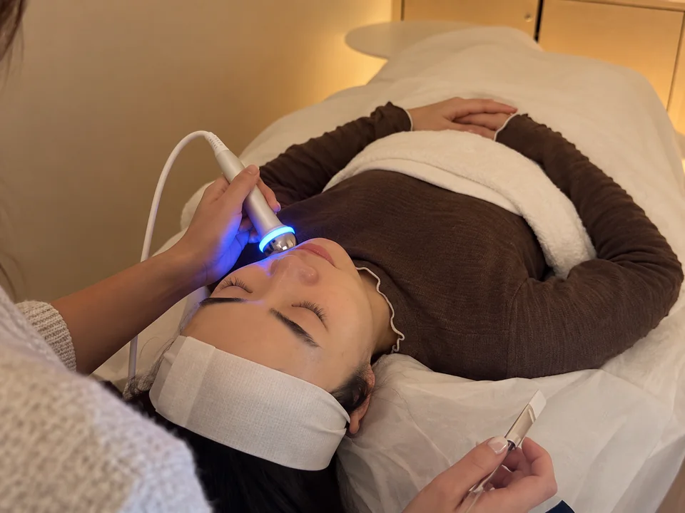 Facial: a client relaxing in the treatment room